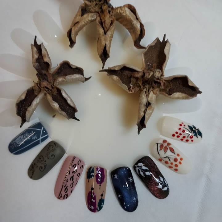 photo showing an arrangement of colourful decorated gel nails