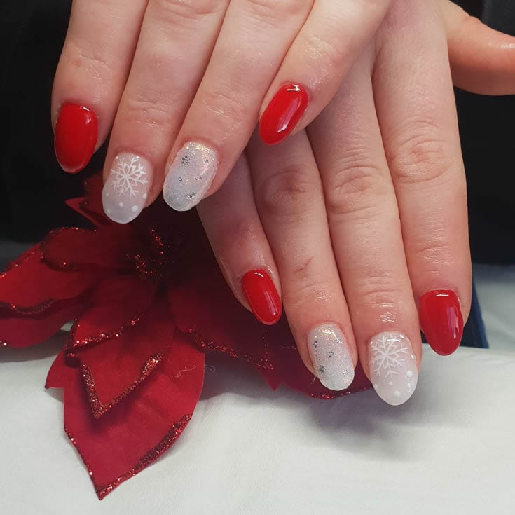 image of customer hands with red and white feature nails done