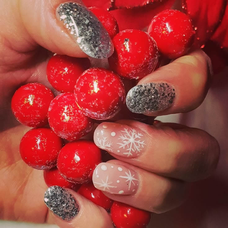 photo of customer hand with xmas themed nails