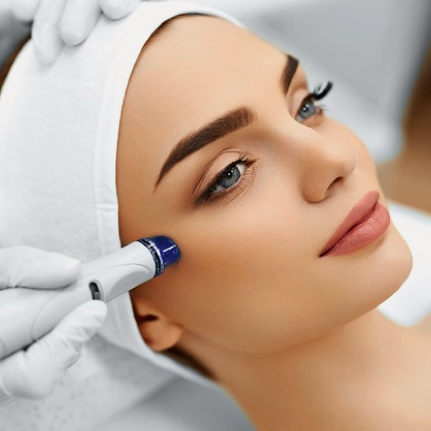 image of womans head having microdermabrasion treatment